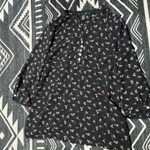 Black floral blouse with 3/4 sleeve. Button details down front.
